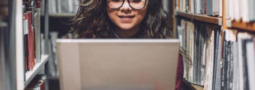 girl in library stacks