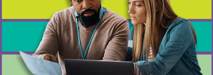 Man and woman looking at notebook