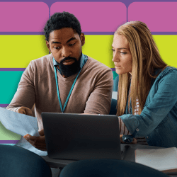 Man and woman looking at notebook