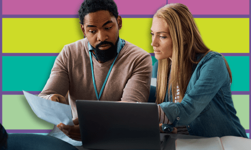 Man and woman looking at notebook